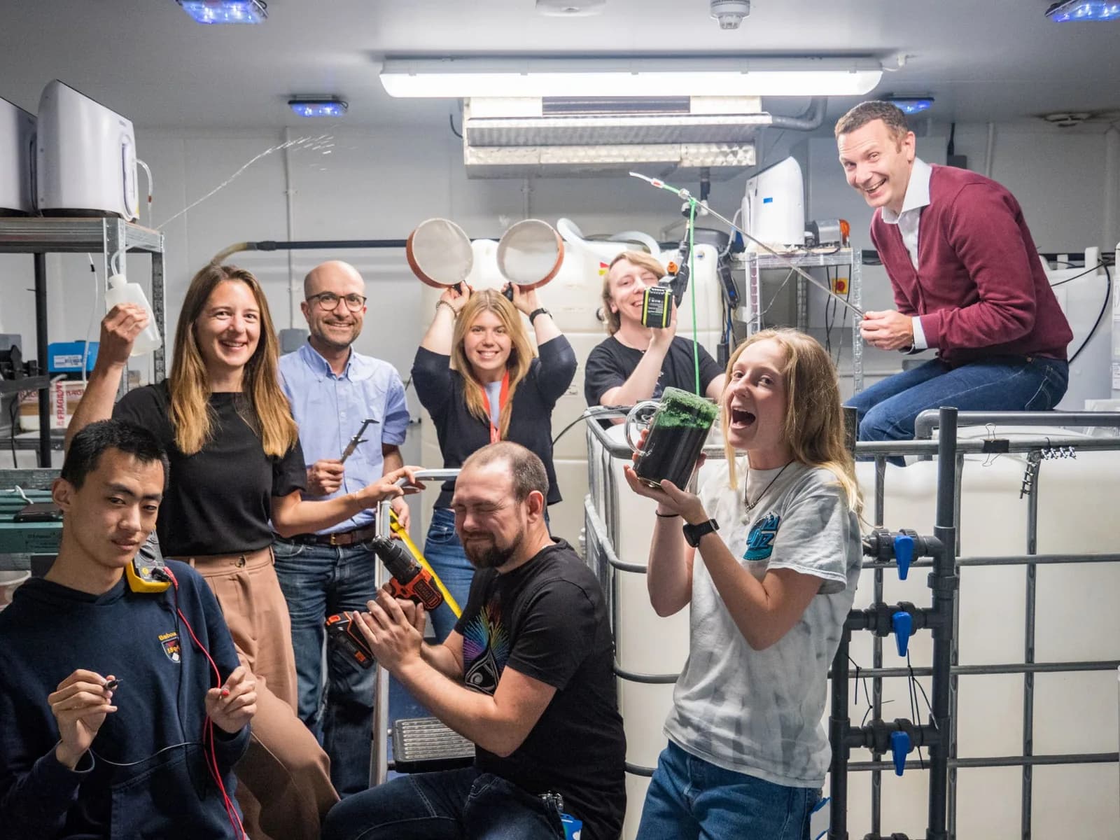 The Aquanzo team in our first lab, with culture tanks and equipment